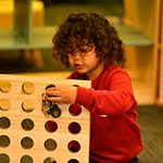 Boy counting at Lulla's Children and Family Centre